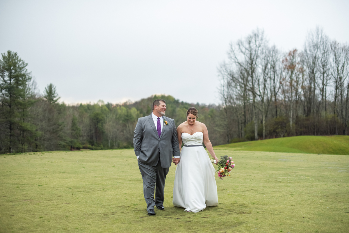 Couple walking at Connestee Falls Wedding