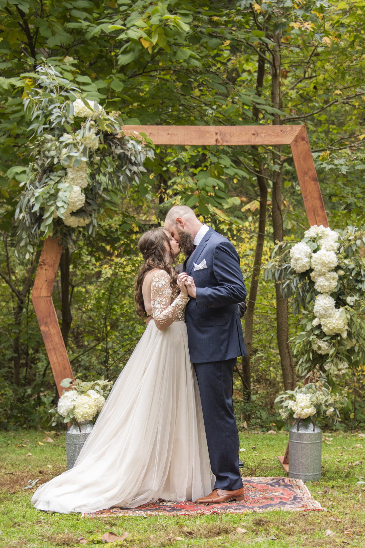 First kiss at Asheville botanical gardens wedding