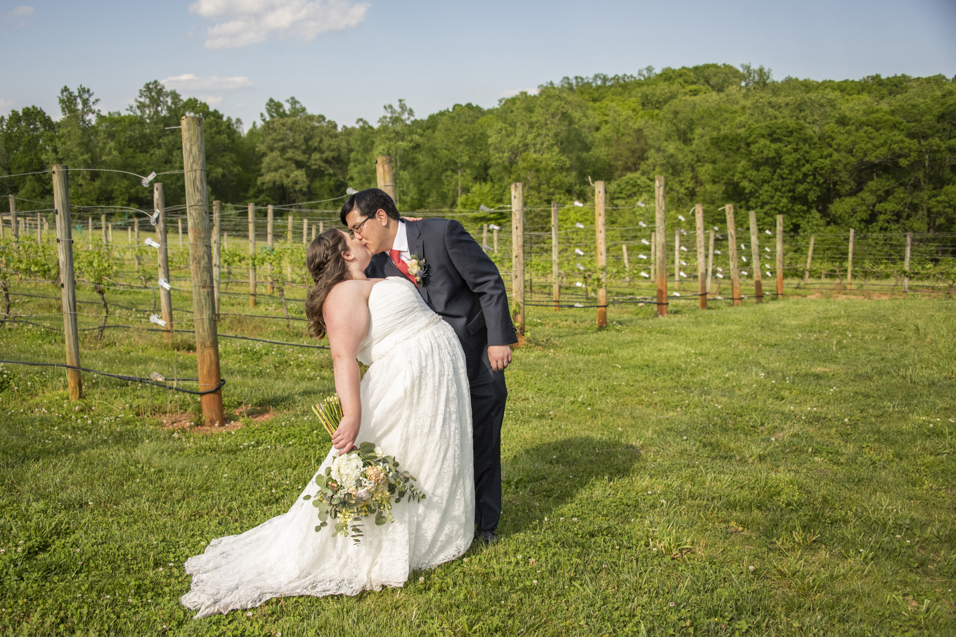 Groom dipping bride at Spinning Leaf Wedding