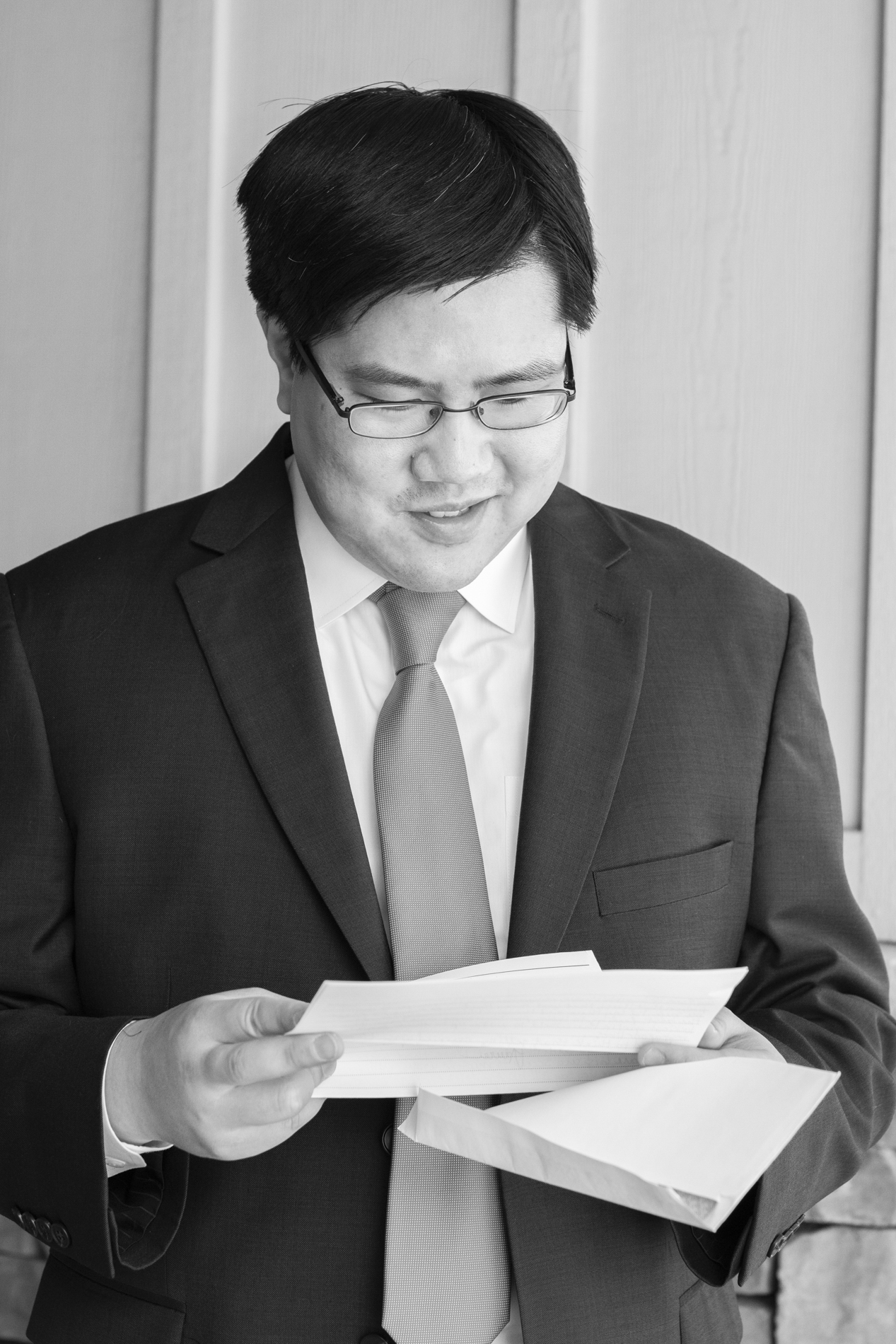 Groom reading letter