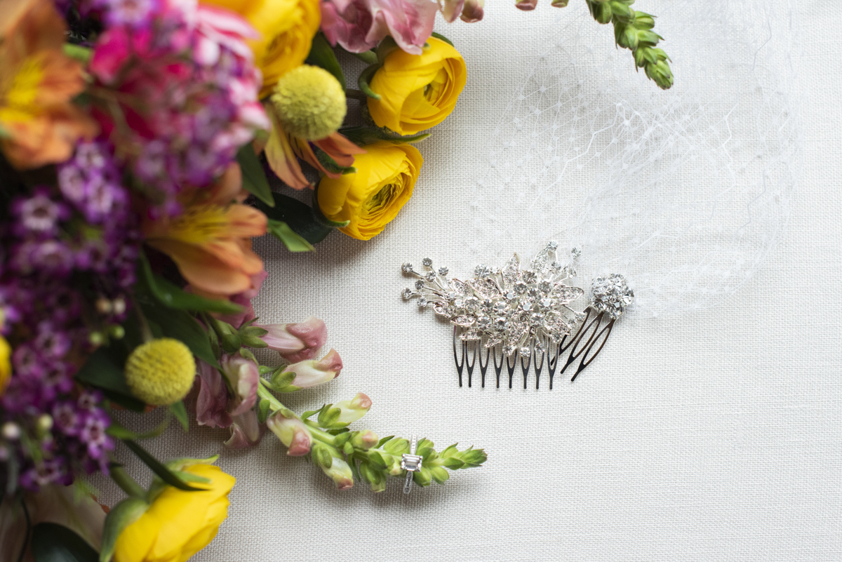 Wedding veil and hairpiece with engagement ring and bouquet