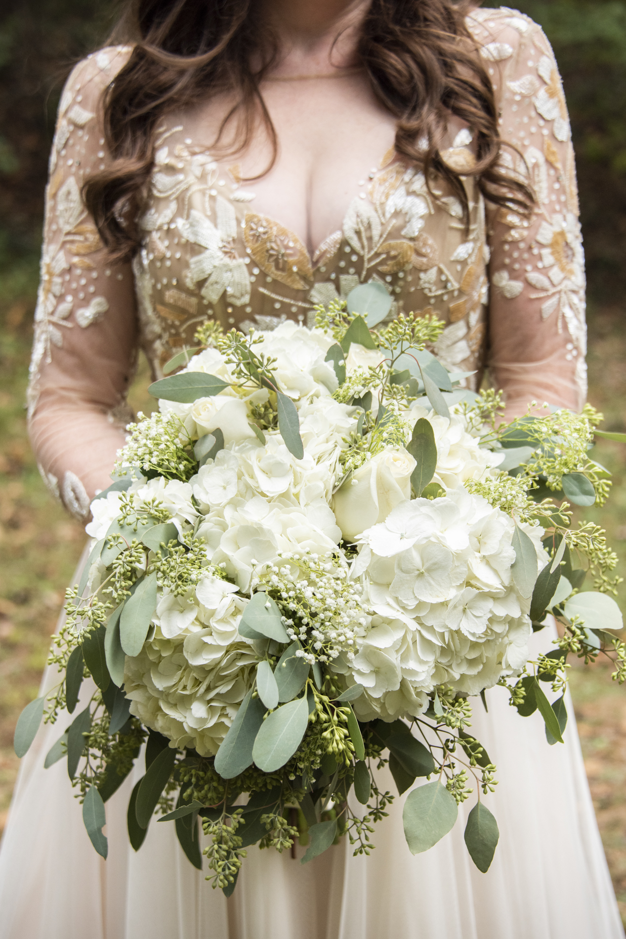 Bride and bouquet at Asheville botanical gardens wedding