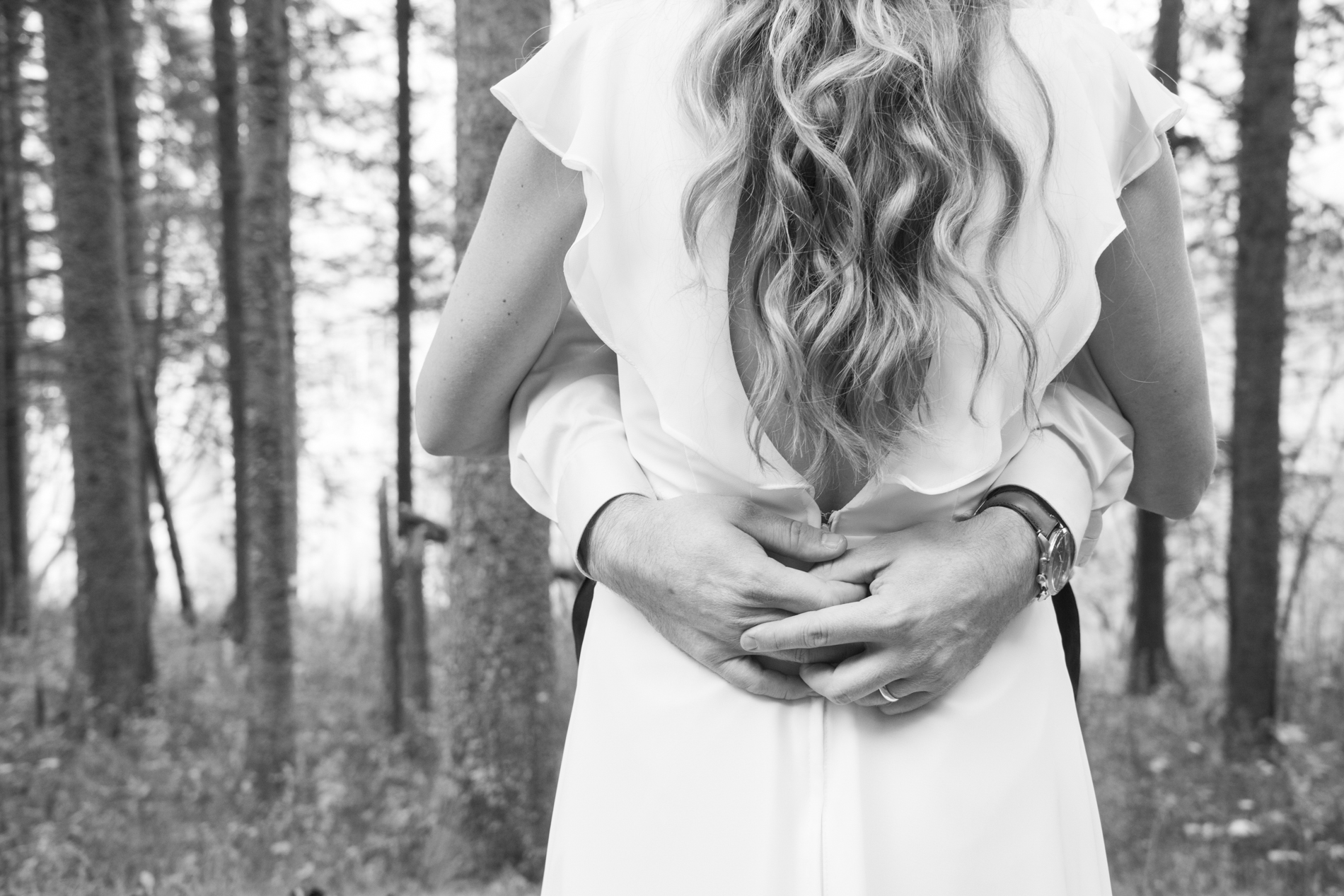 Groom holding onto bride