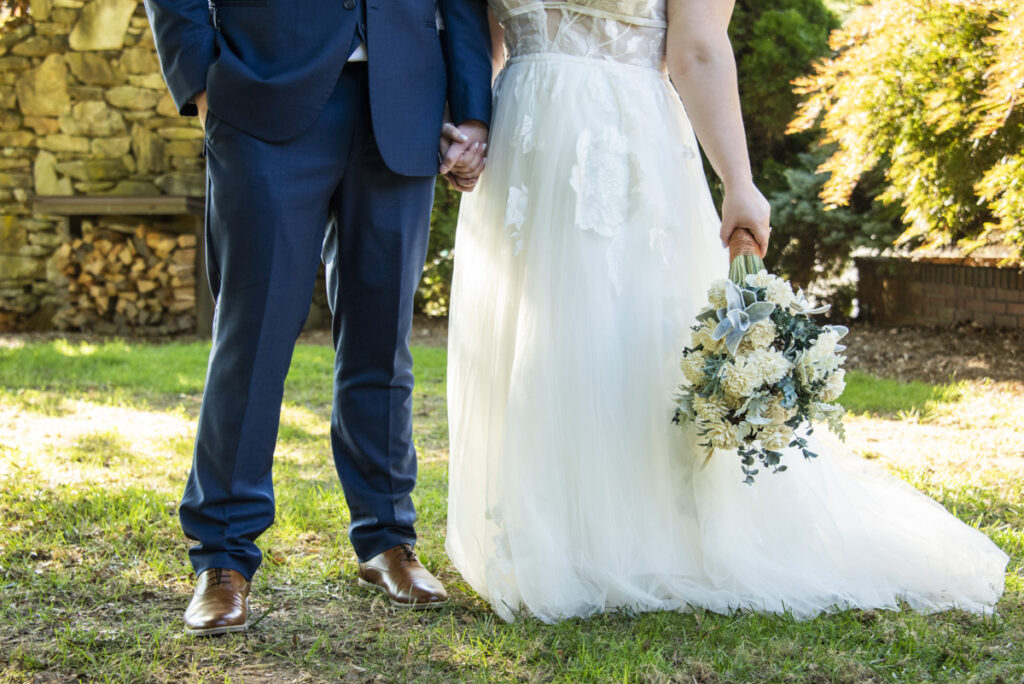 Couple holding hands during wedding photos
