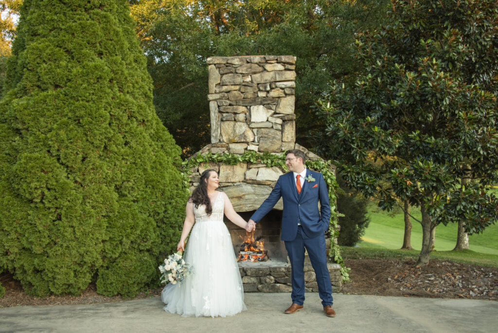 Wedding couple holding hands at Omni Grove Park Inn Wedding