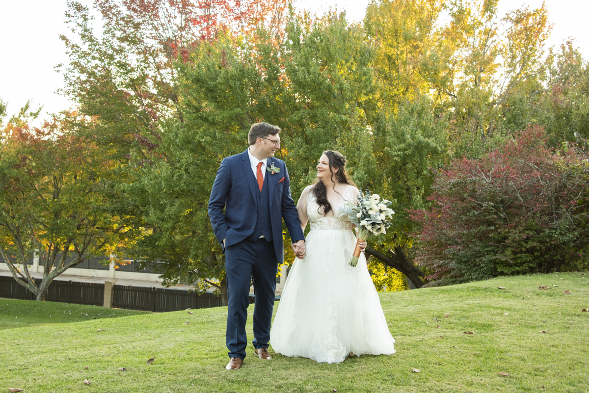 Couple walking during photos at Omni Grove Park Inn Wedding