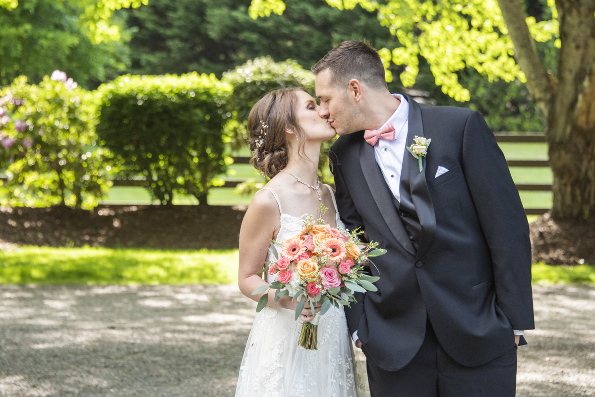 Couple kissing at Hawkesdene Wedding