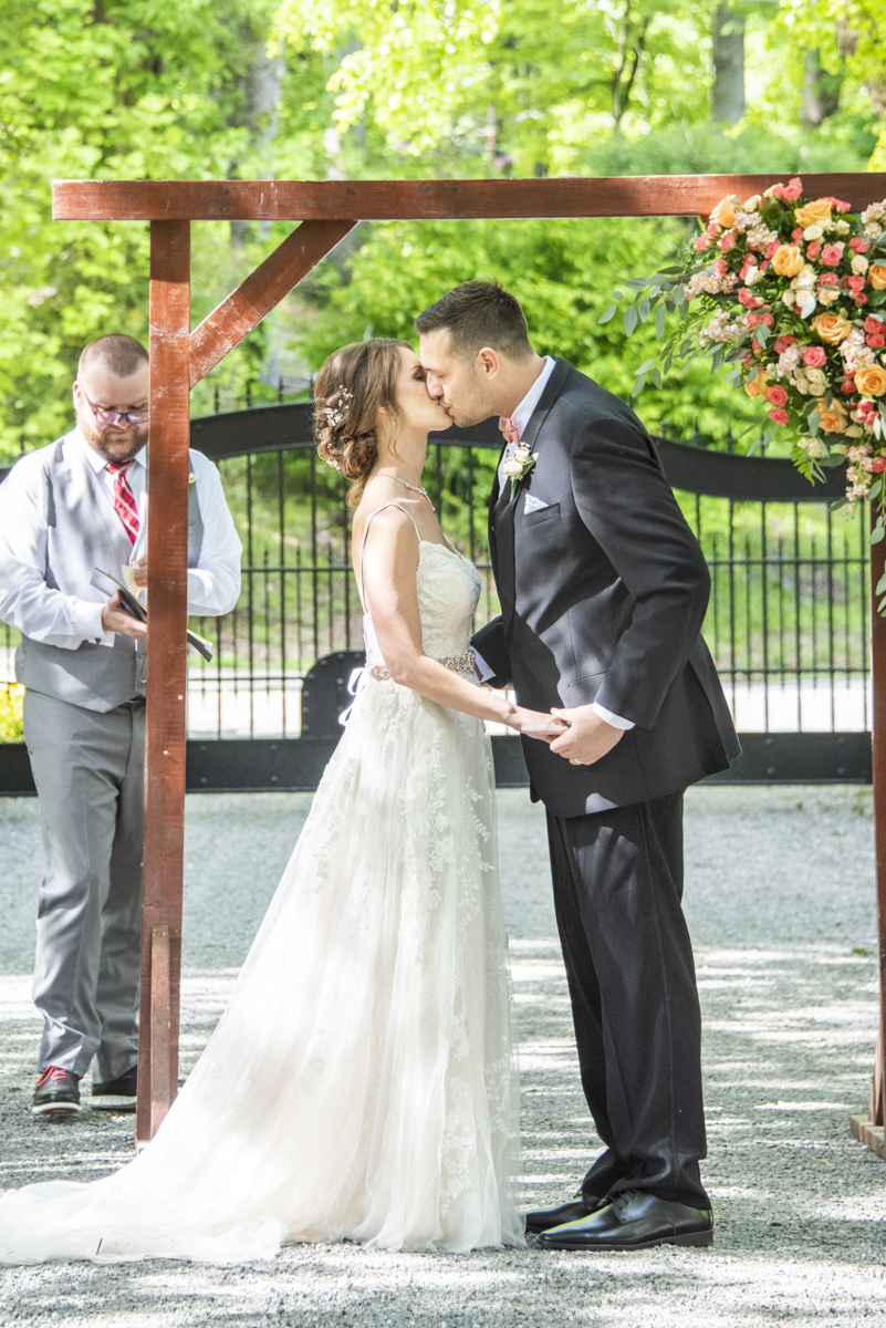 Couple kissing at Hawkesdene Wedding