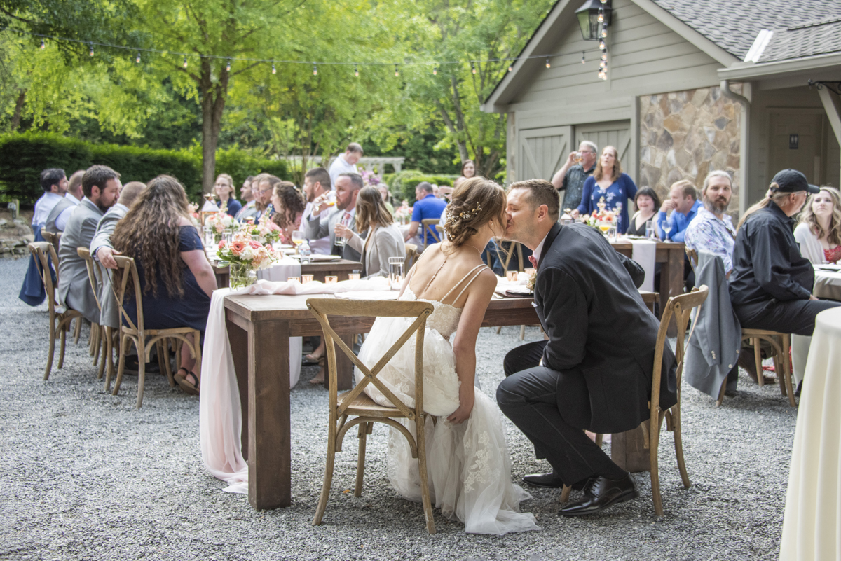 Couple kissing at Hawkesdene Wedding