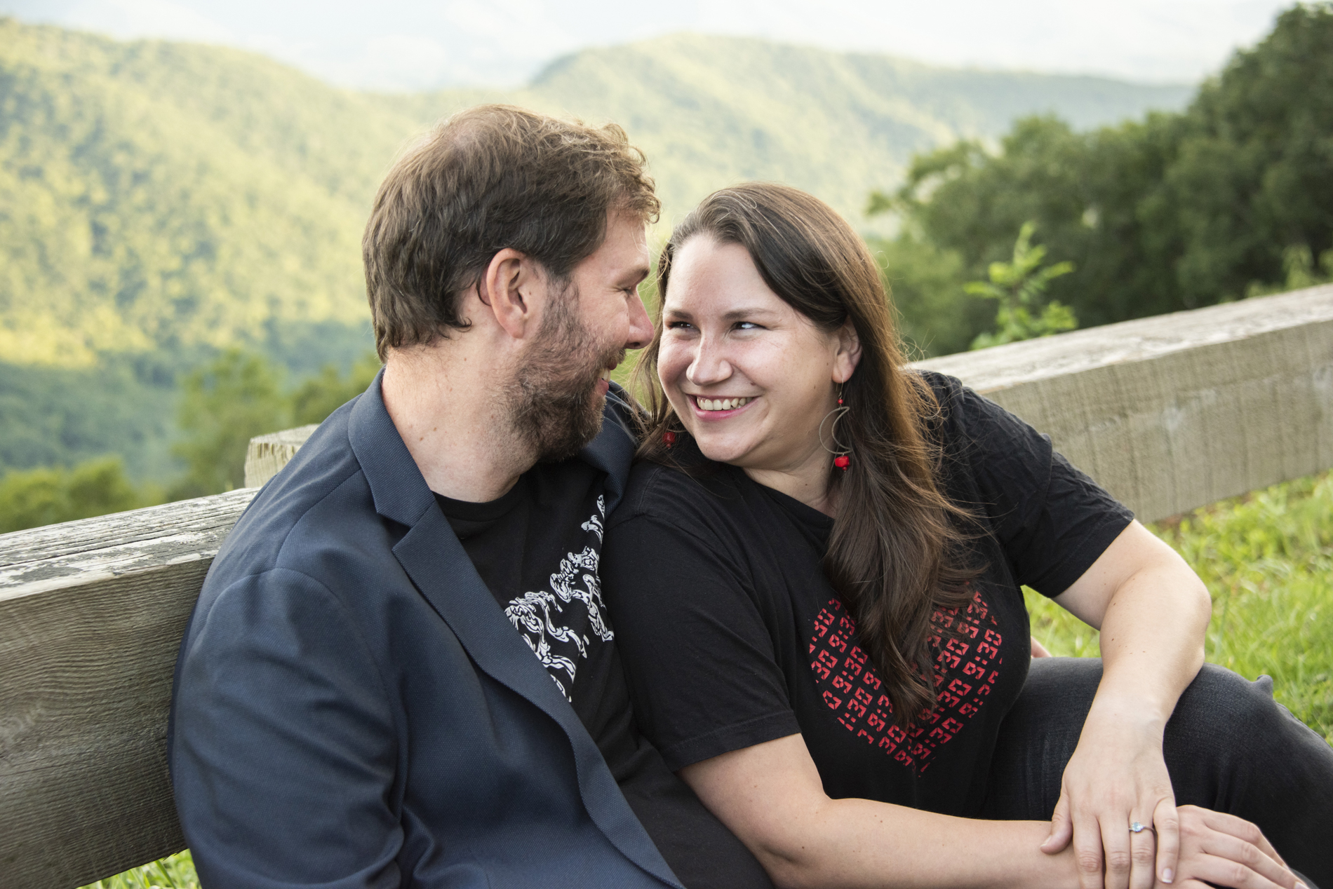 Couple smiling with mountains behind during Black Mountain Photography