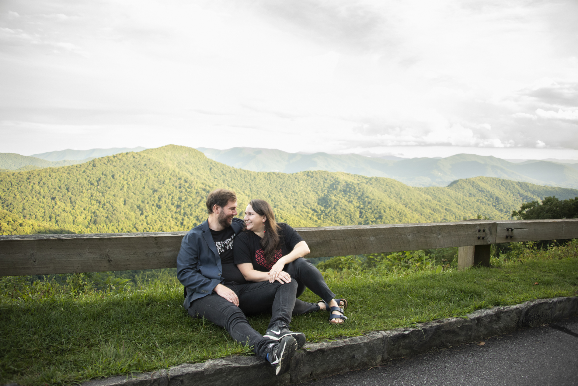 Couple sitting with mountains behind during Black Mountain Photography