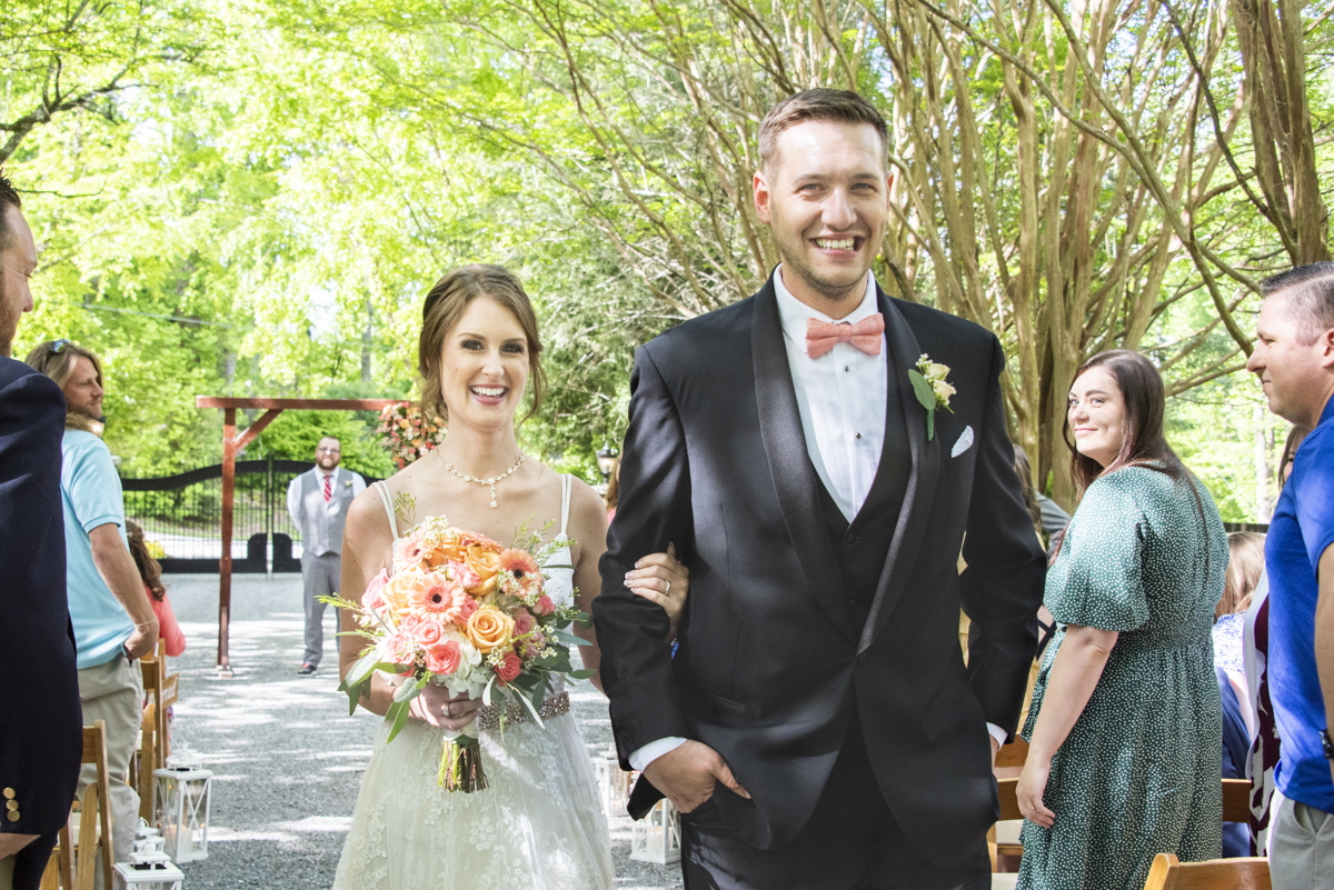 Couple walking down aisle at Hawkesdene Wedding