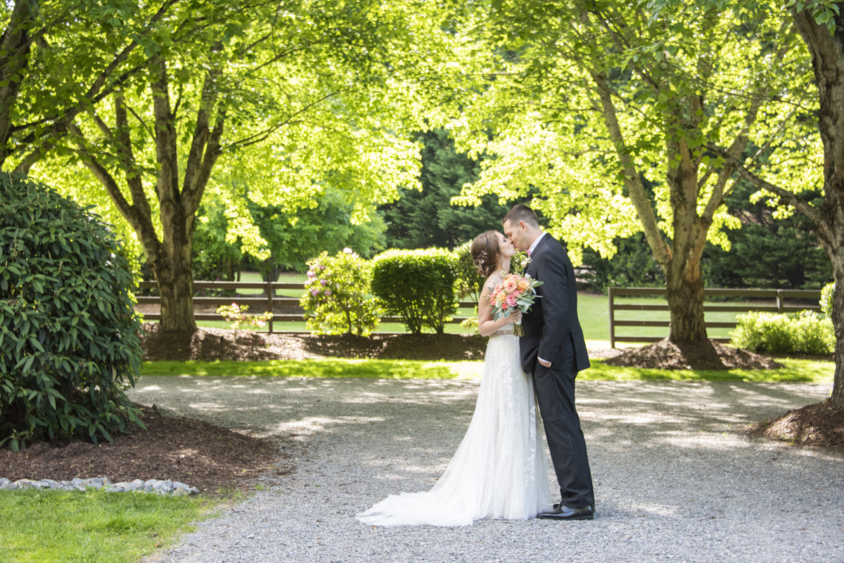 Couple kissing at Hawkesdene Wedding
