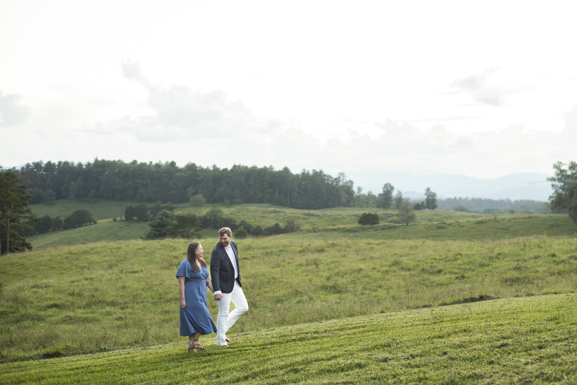 Couple walking with mountains behind