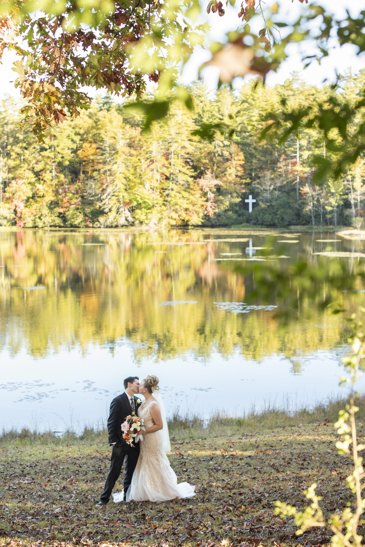 Couple kissing by lake