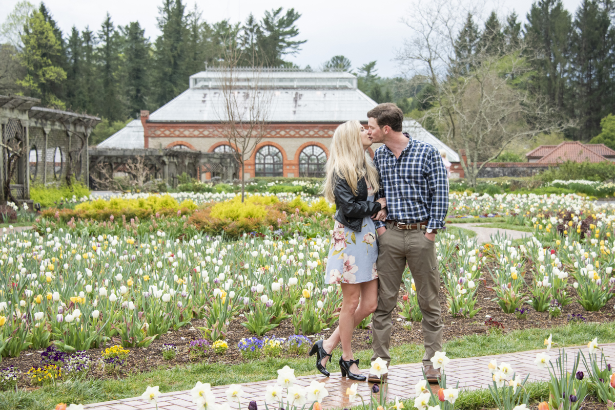 Couple kissing among tulips at Biltmore Estate Proposal