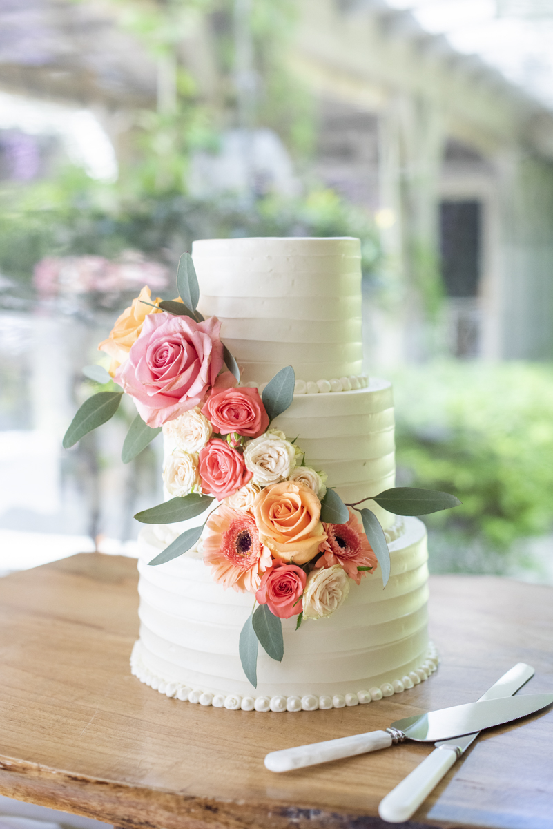 Wedding cake with flowers at Hawkesdene Wedding