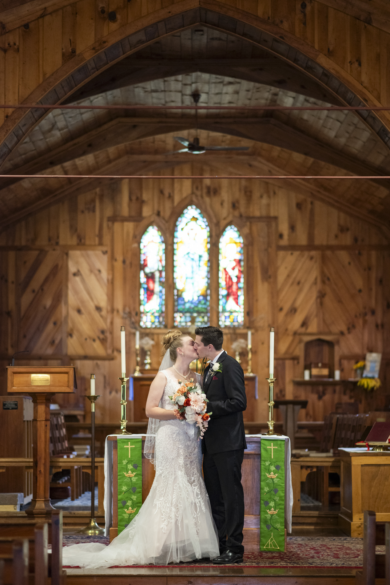 Couple kissing in chapel at Kanuga Wedding
