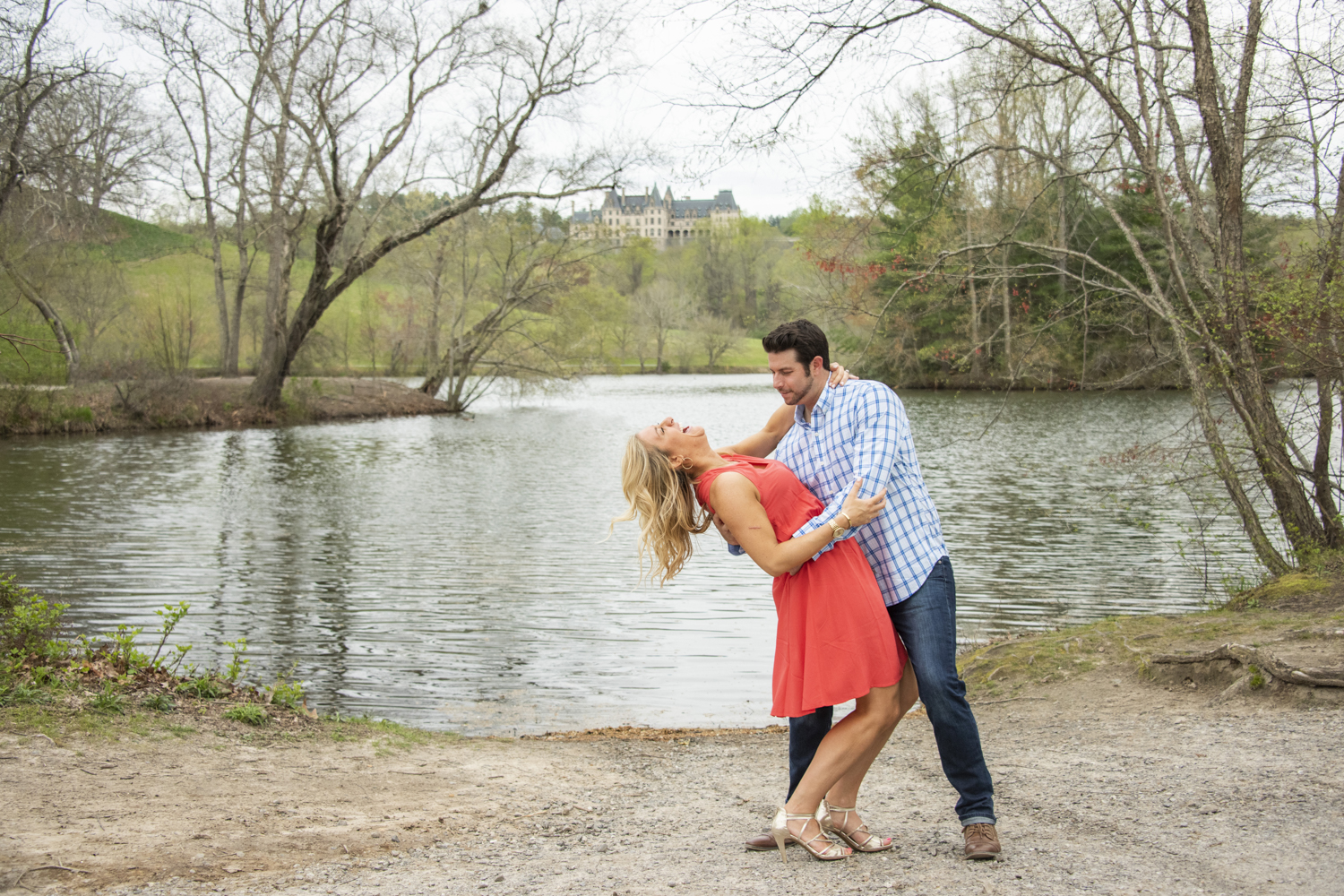 Couple laughing and dipping during Biltmore Engagement Photos