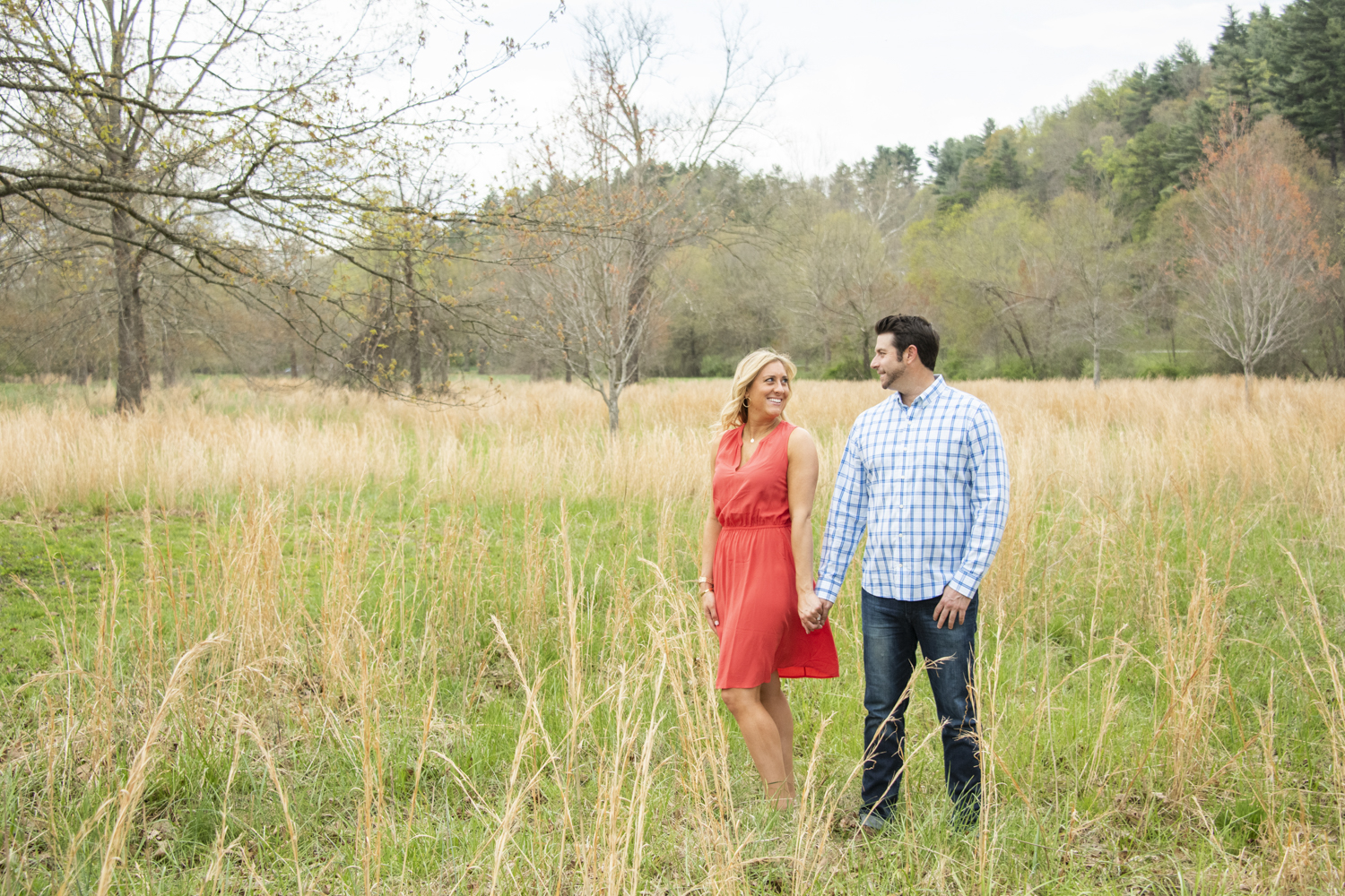 Couple smiling in field