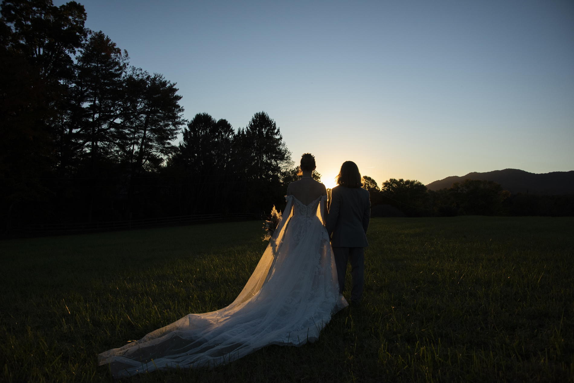 Silhouette of bride and groom in mountains