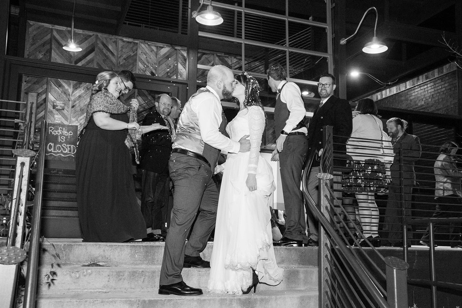 Couple kissing at Highland Brewery Wedding exit