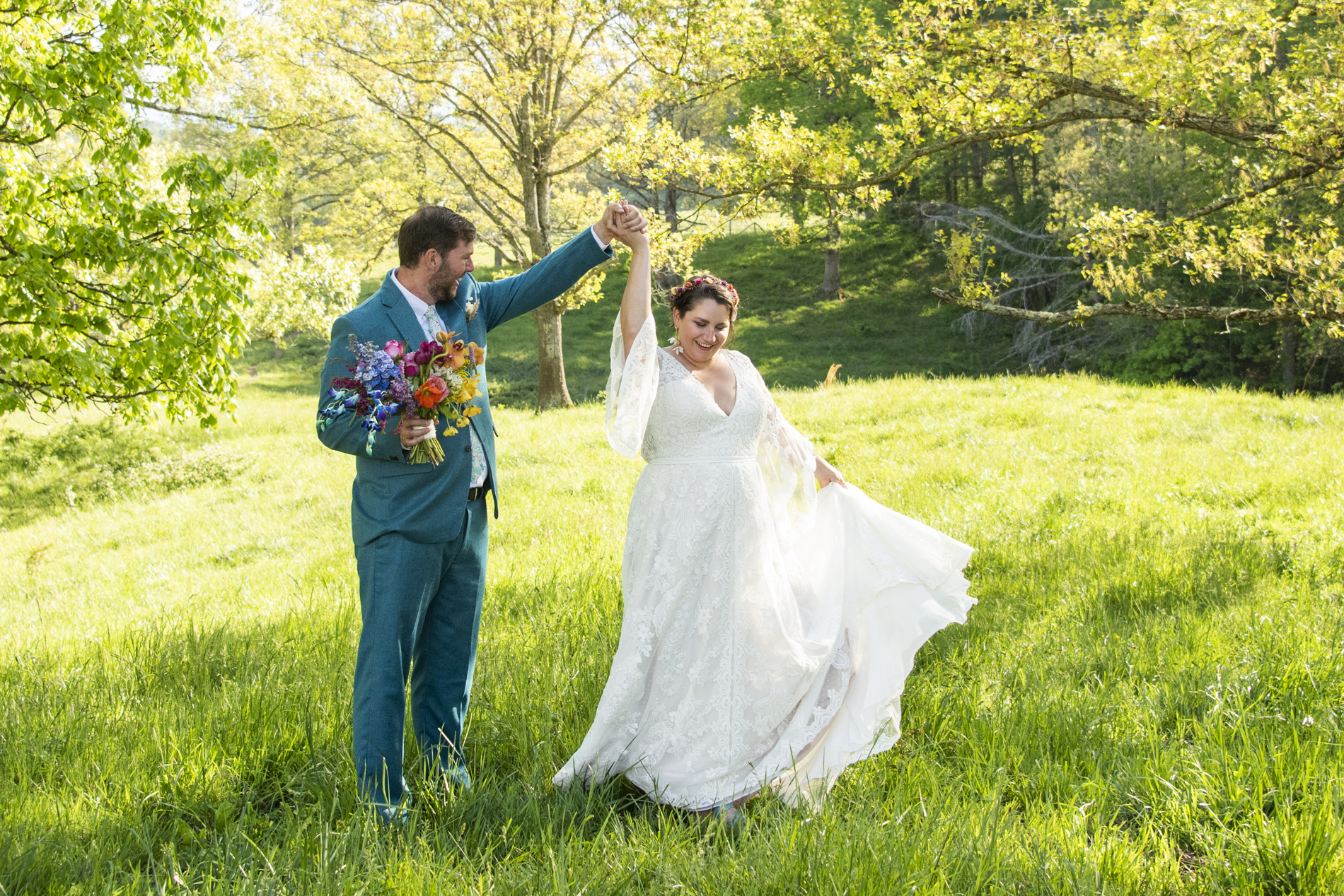 Couple dancing in field at Emerald Ridge Farm