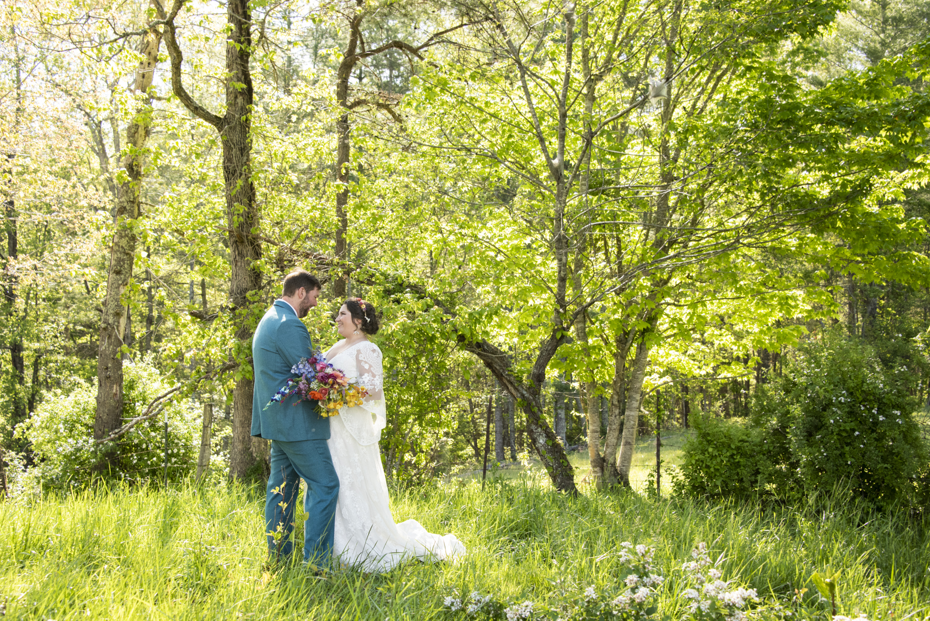 Couple dancing in field at Emerald Ridge Farm