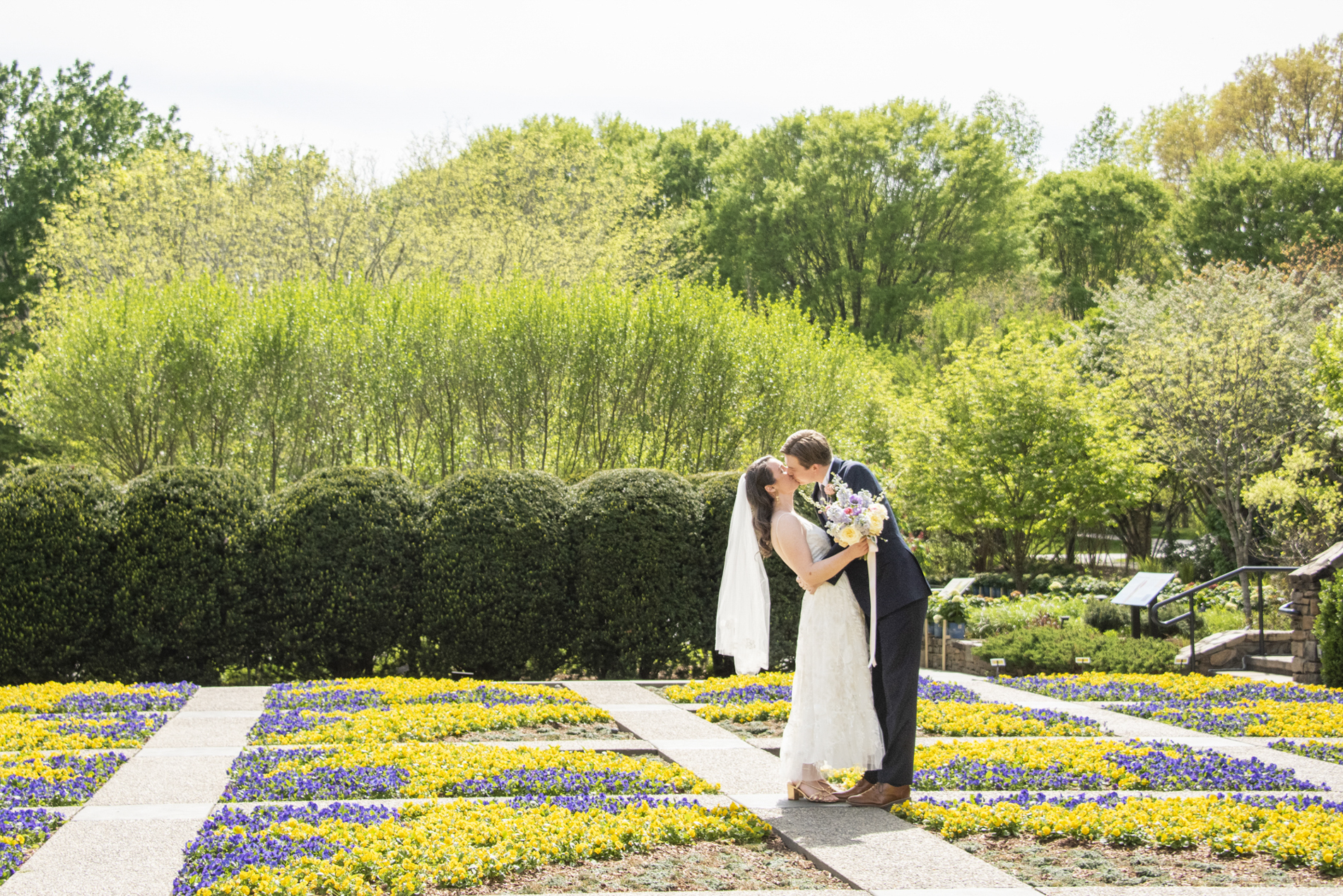 Couple kissing at NC Arboretum weddings