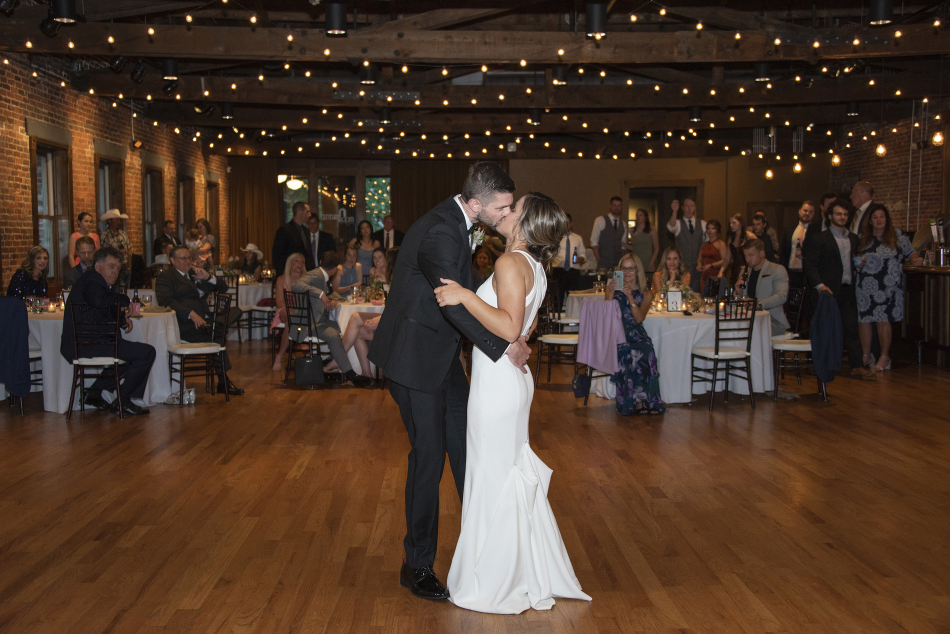 Couple kissing at Century Room on the Park