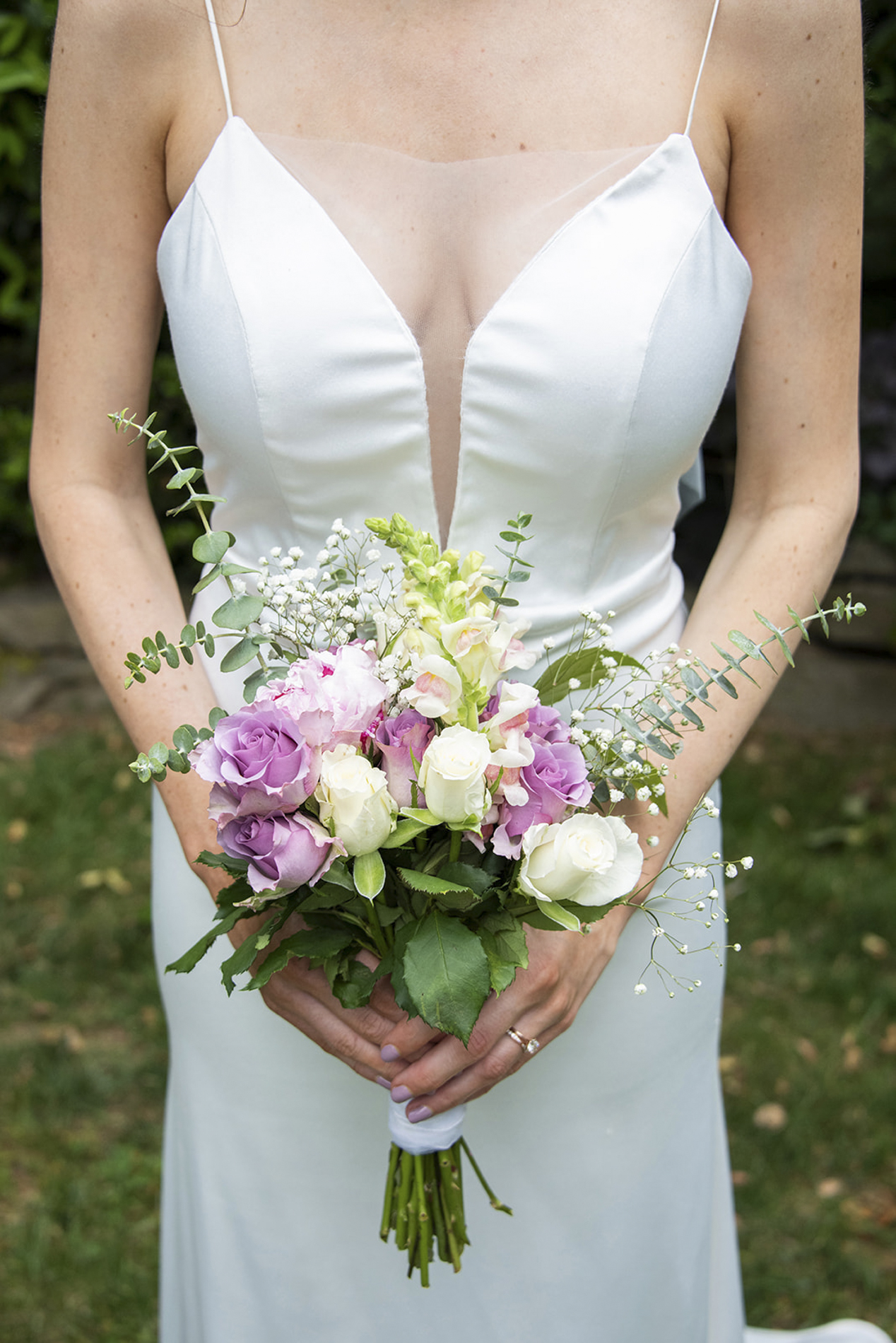bridal holding bouquet