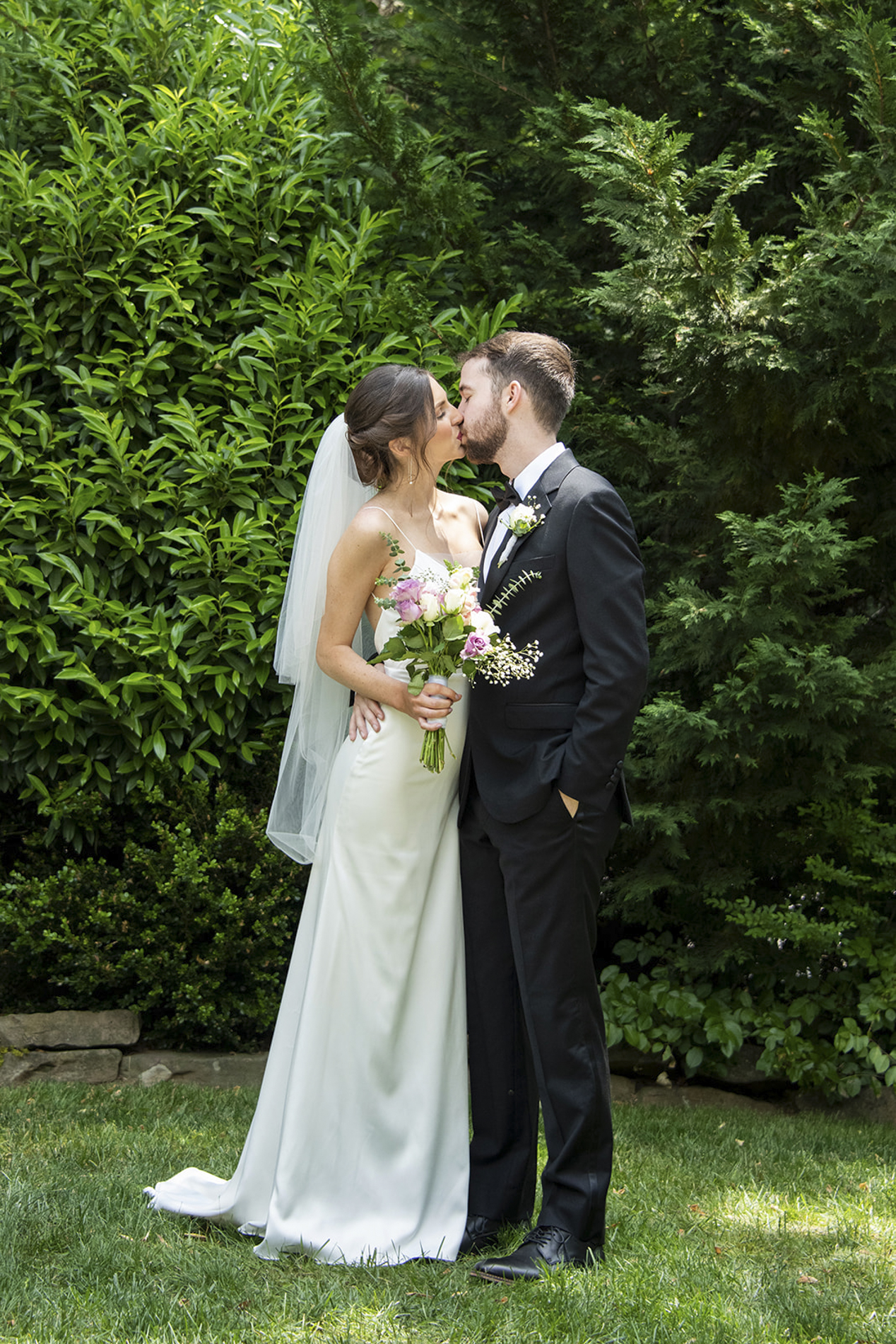 Couple kissing at Homewood Asheville wedding