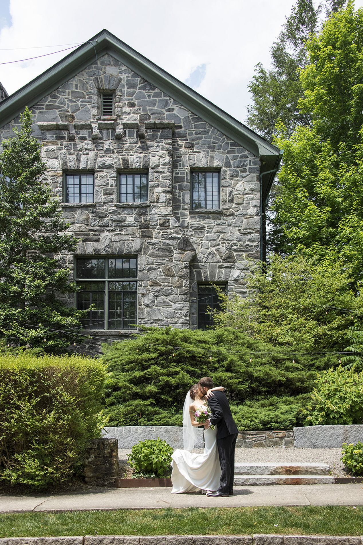 Couple kissing at Homewood Asheville wedding