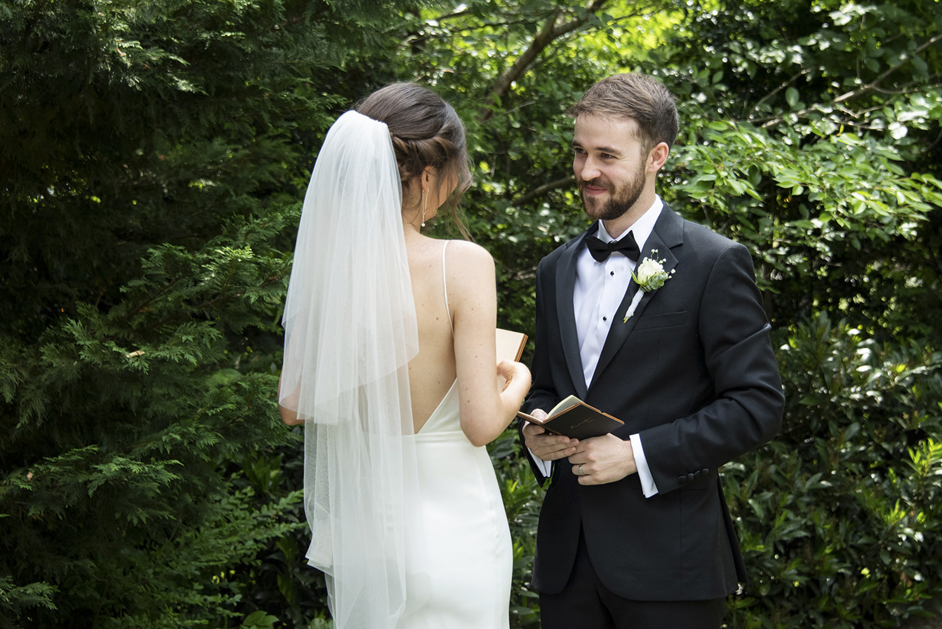 groom looking at bride during private vows
