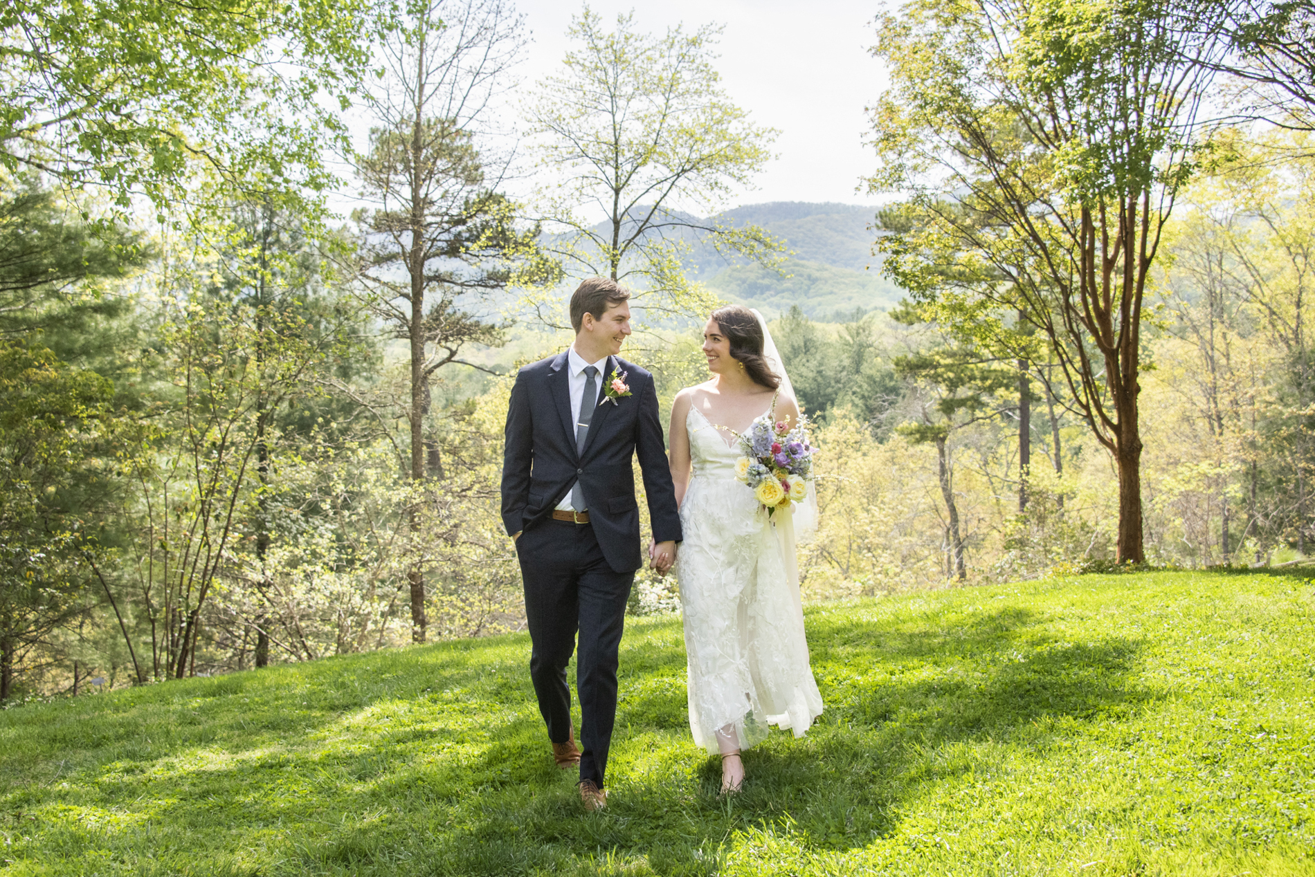 Couple walking at NC Arboretum weddings