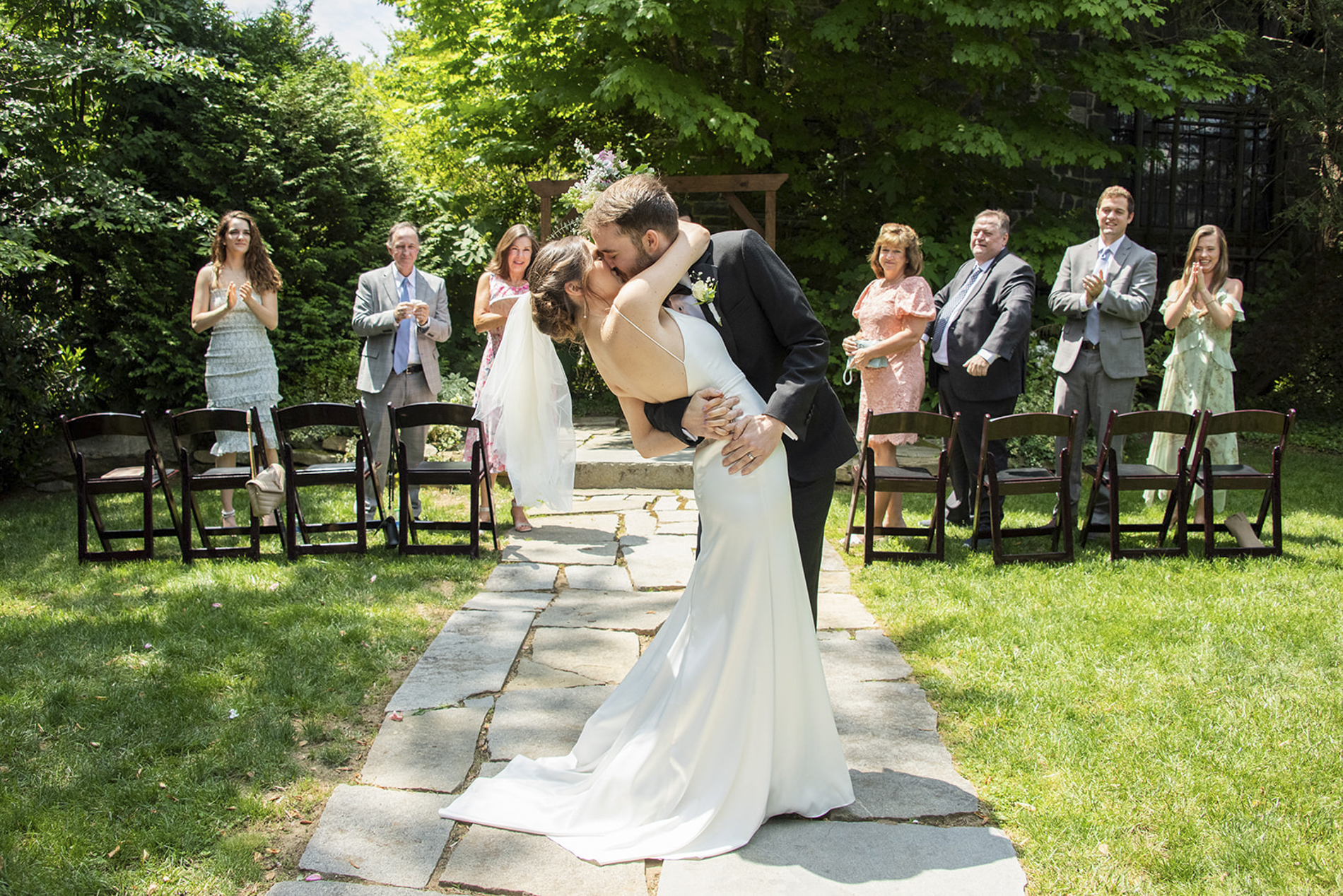 couple kissing in wedding aisle at Homewood Asheville wedding