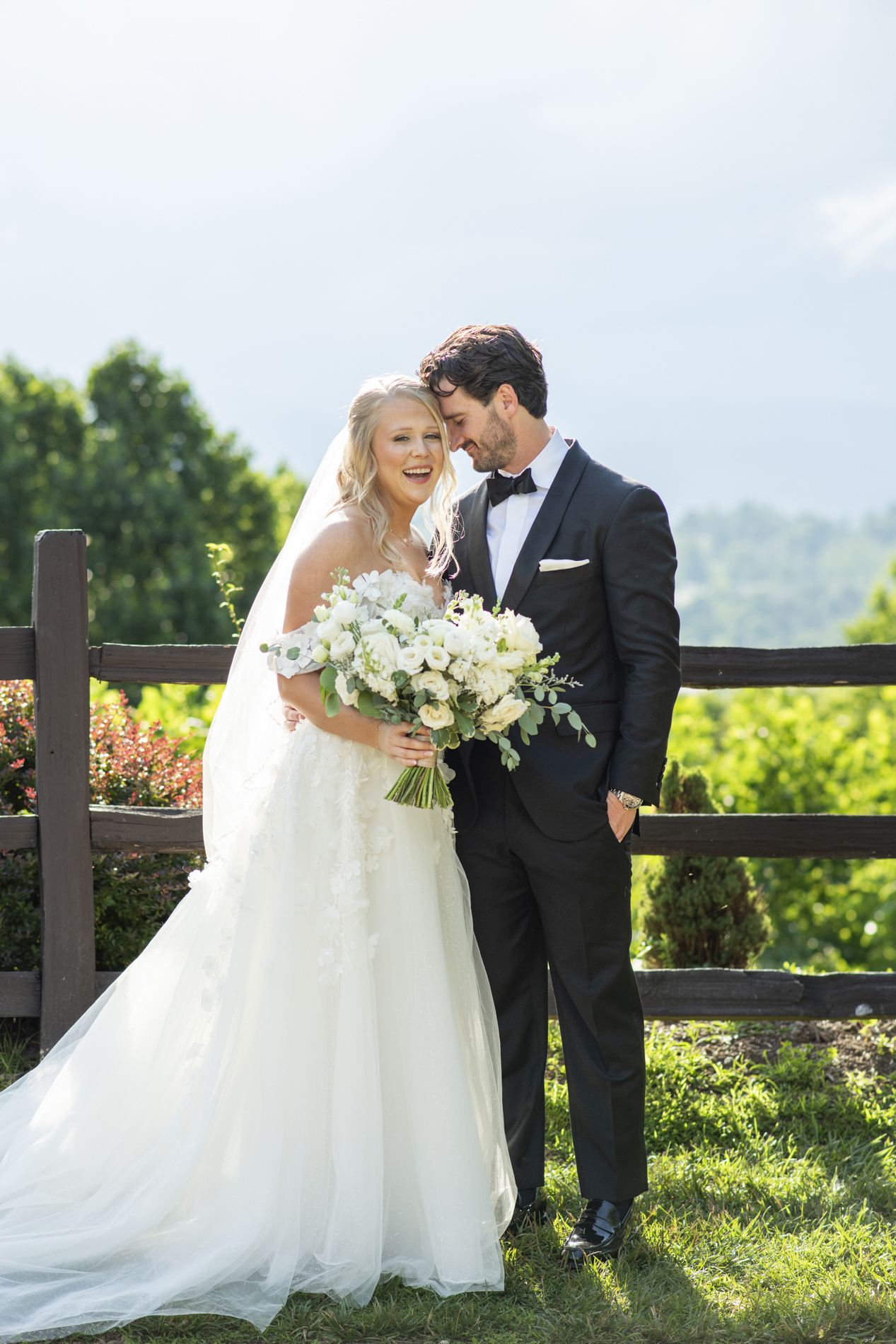 Couple laughing with mountain views at wedding at Crest Center and Pavilion