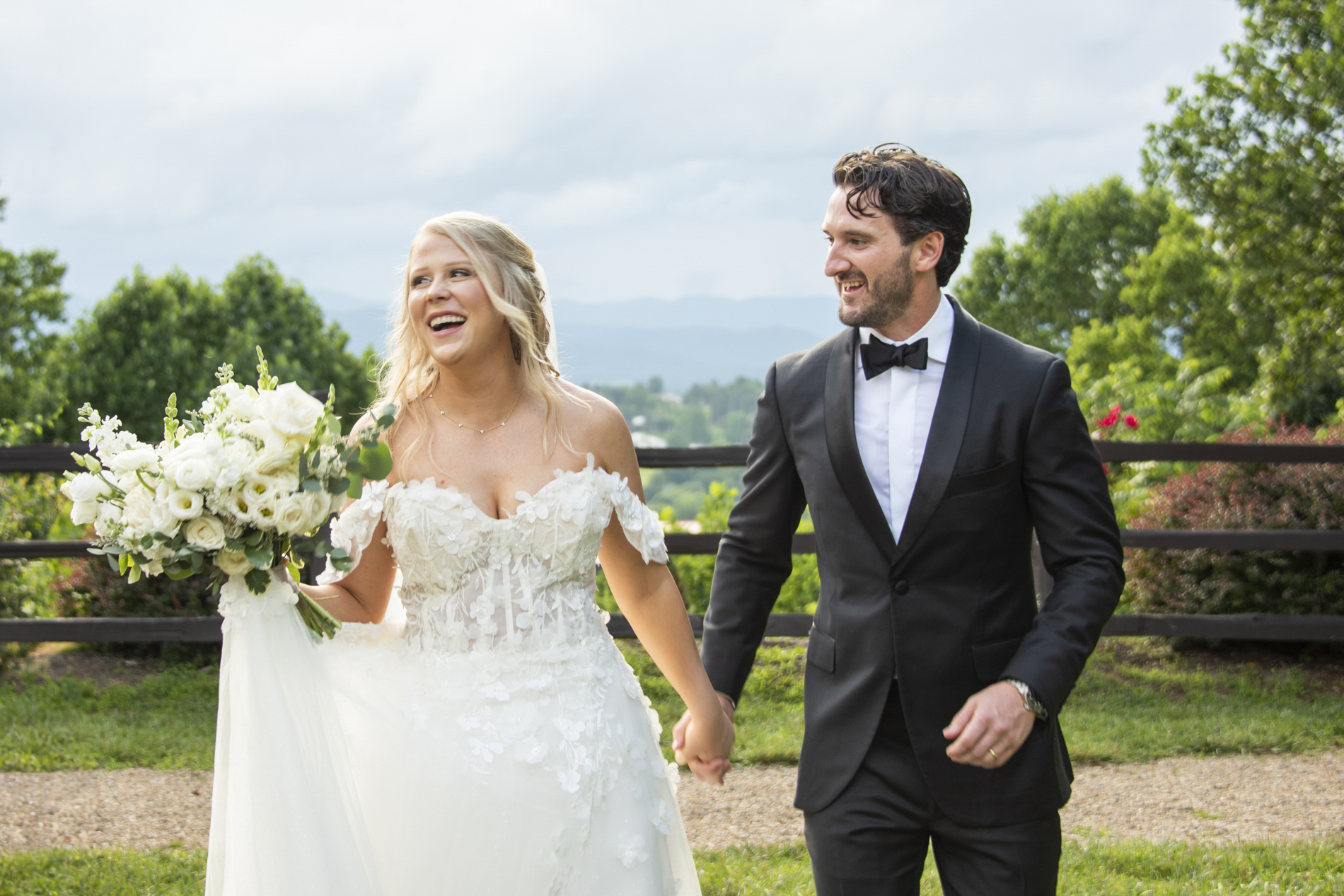 Couple laughing with mountain views at wedding at Crest Center and Pavilion