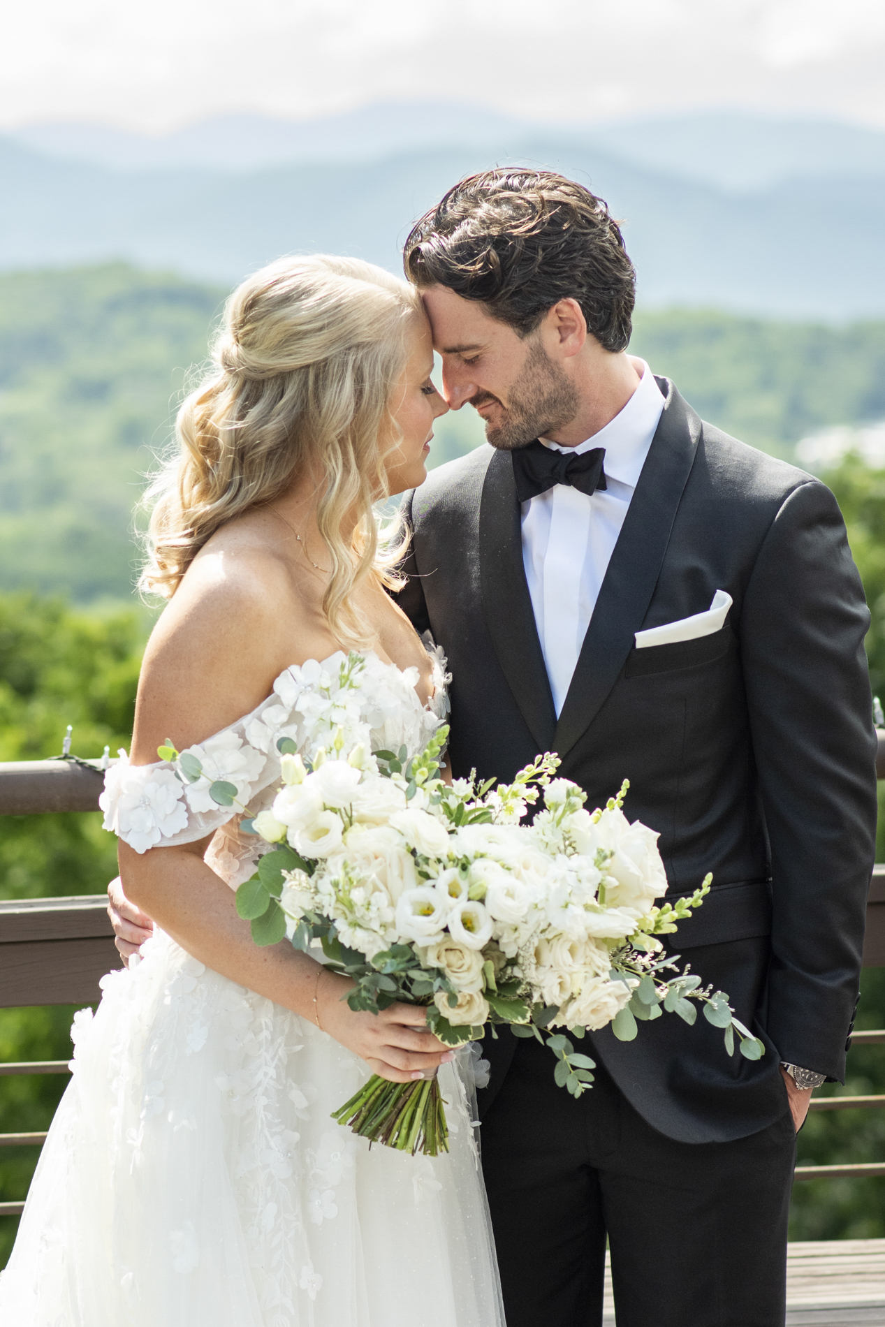 Couple snuggling at wedding at Crest Center and Pavilion