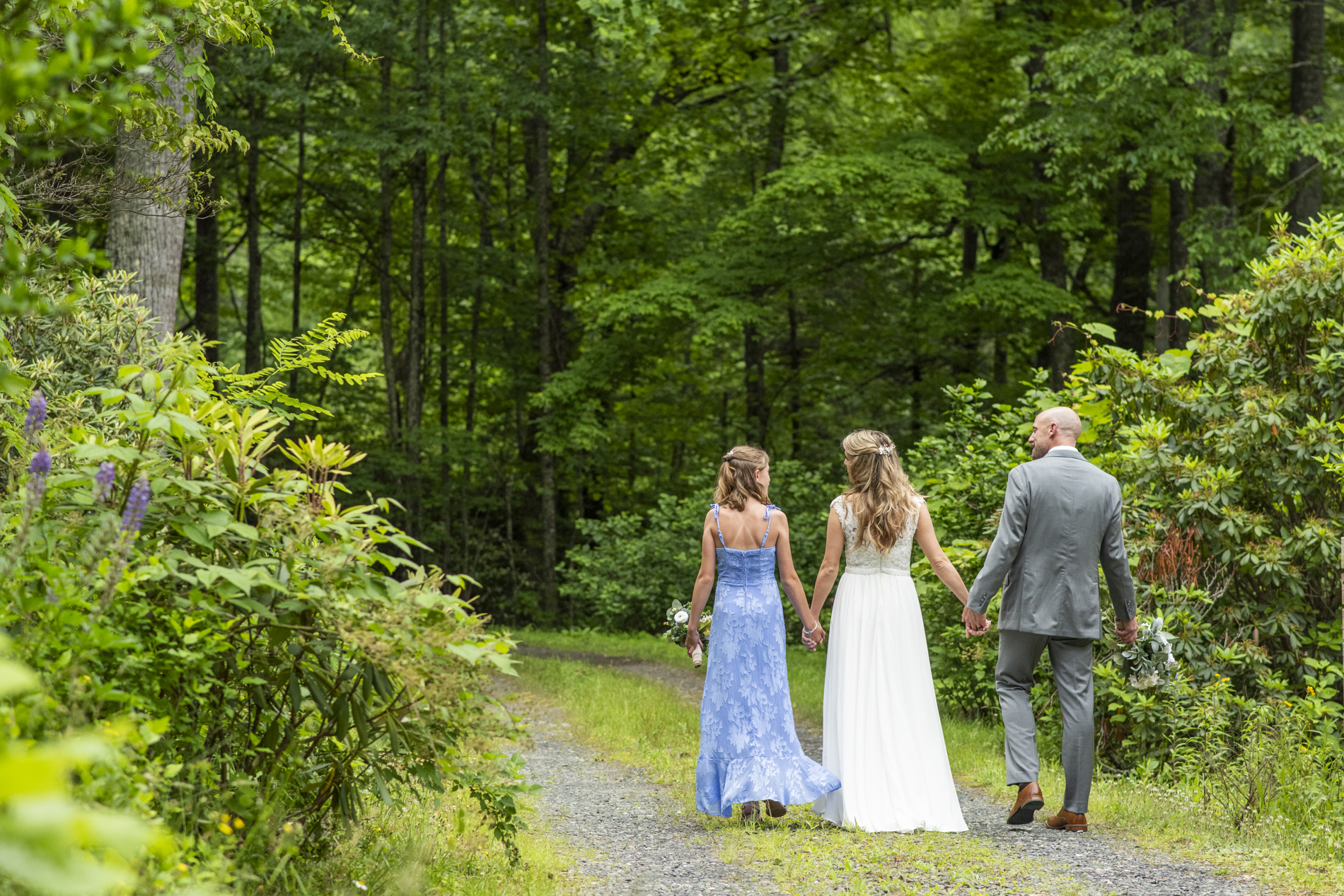 Mount Mitchell Wedding couple walking with daughter