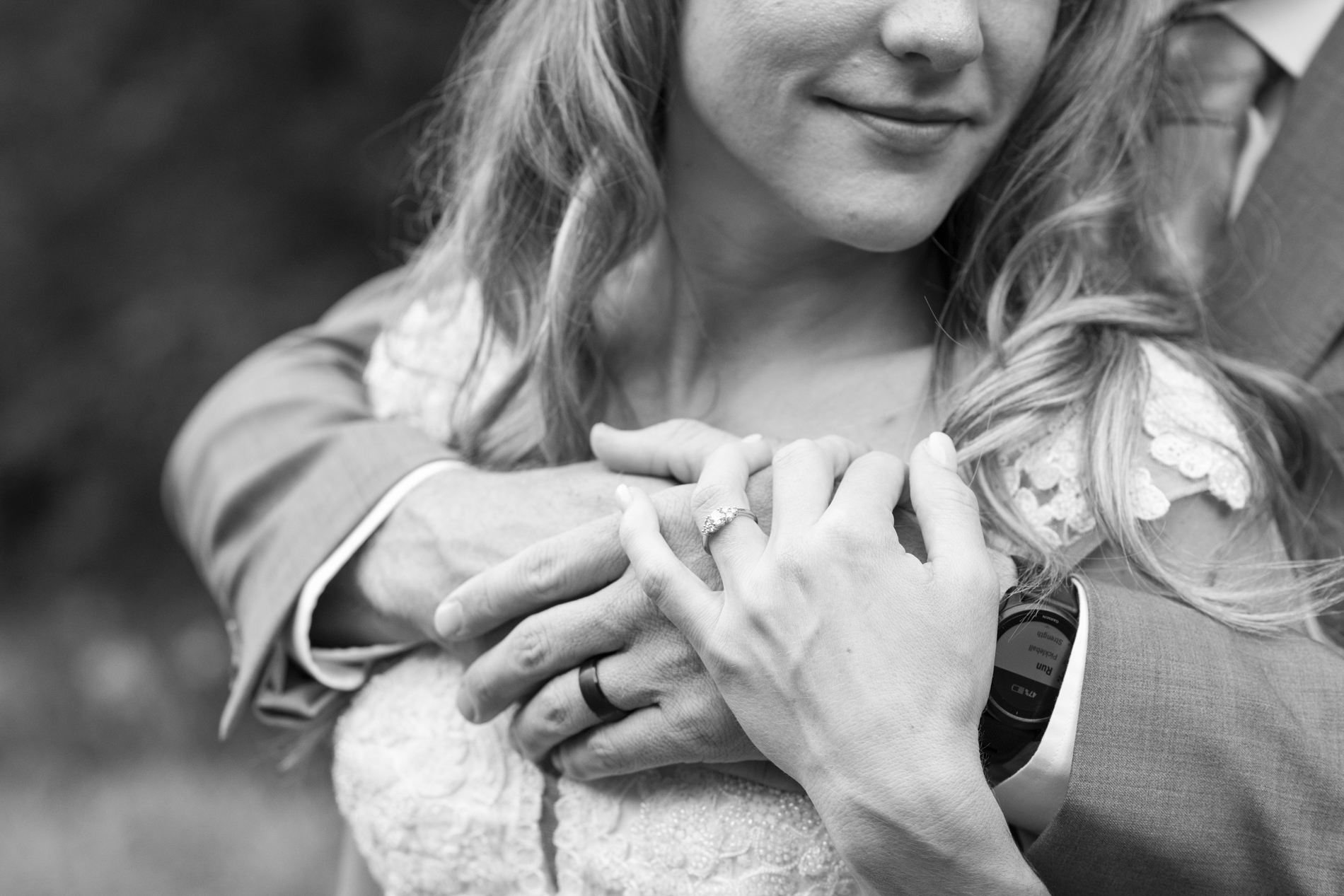 couple snuggling at wedding at Mount Mitchell Wedding