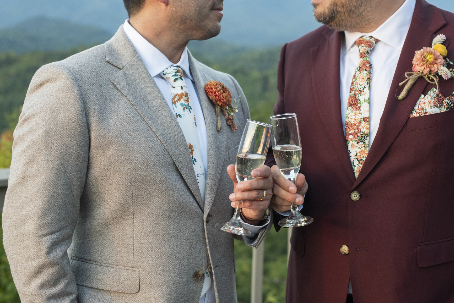 Couple cheers on mountain top at Hawkesdene Estate