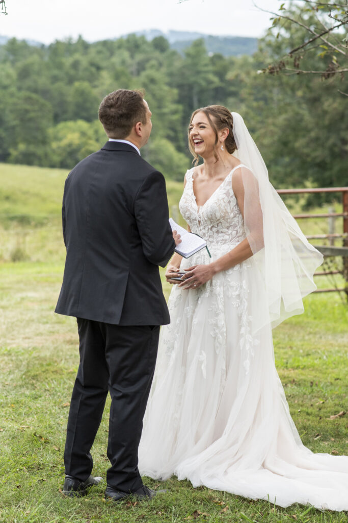 Emerald Ridge Wedding with couple laughing in front of mountain view