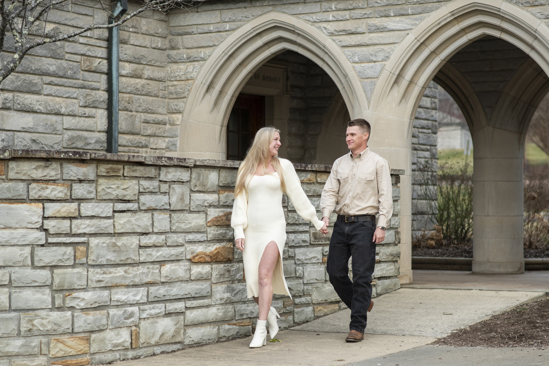 Couple walking at lake junaluska chapel