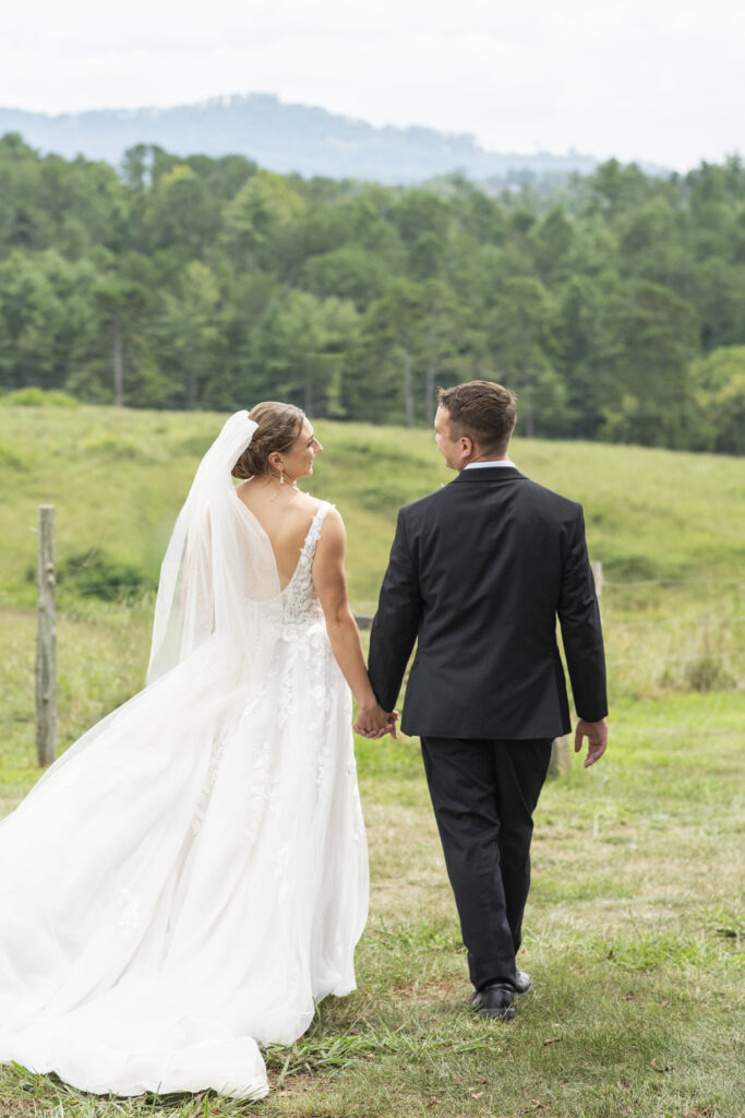 couple walking at Emerald Ridge Wedding