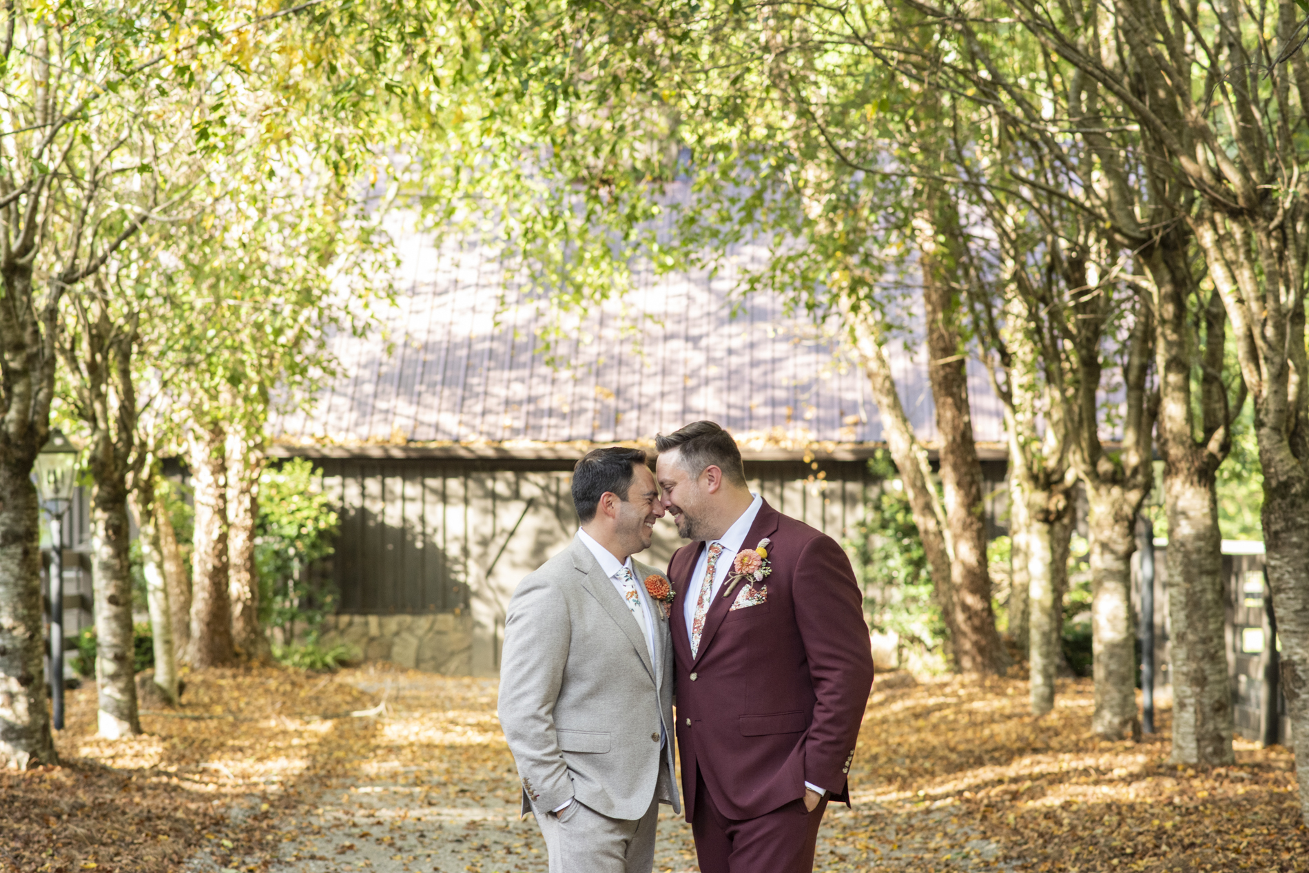 Couple snuggling at sunset same sex wedding at Hawkesdene Estate