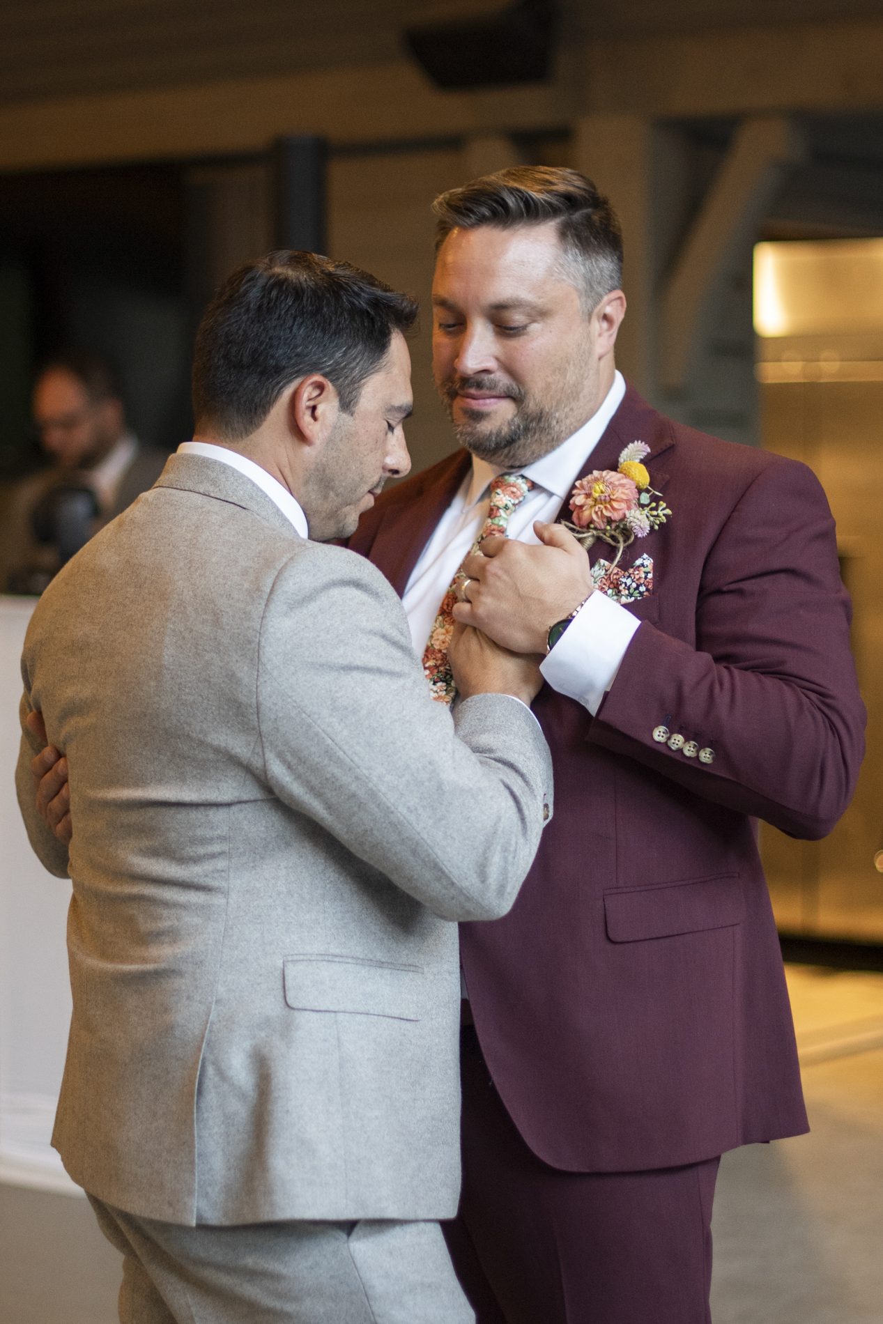 Couple dancing at sunset same sex wedding