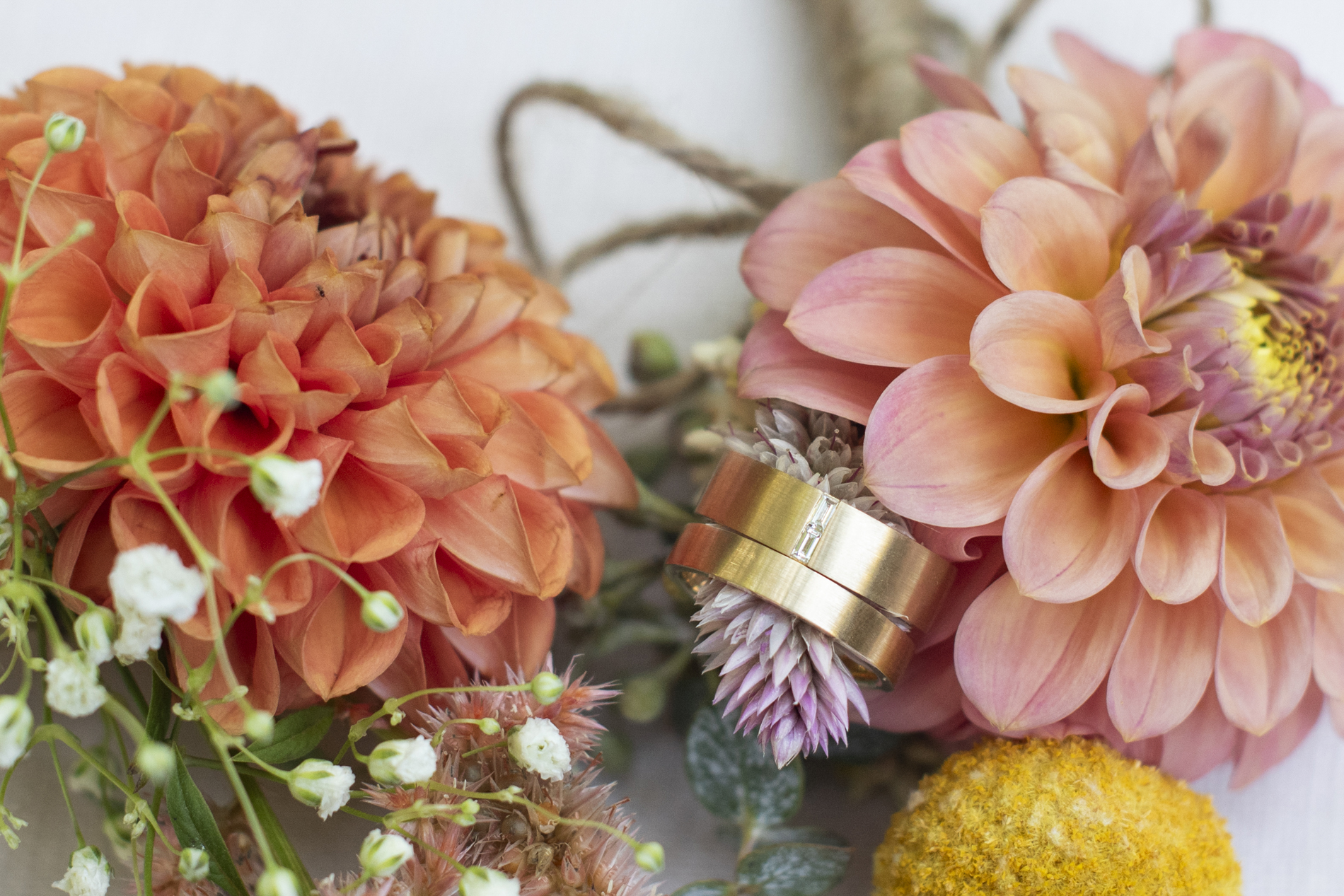 Wedding rings and flowers in autumn