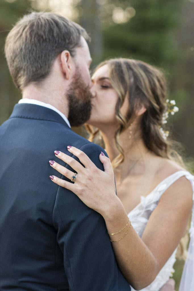 couple kissing at wedding