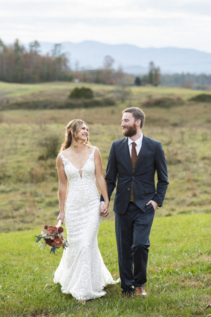 couples walking at wedding at Emerald Ridge Asheville NC